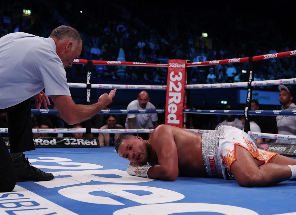 Ref Steve Gray counts Joyce out after Zhang's brutal punch