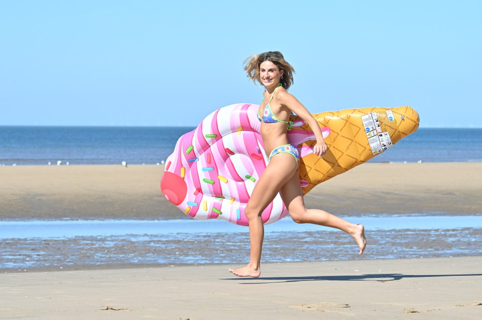 Beachgoers at Blackpool Beach making the most of the hot weather