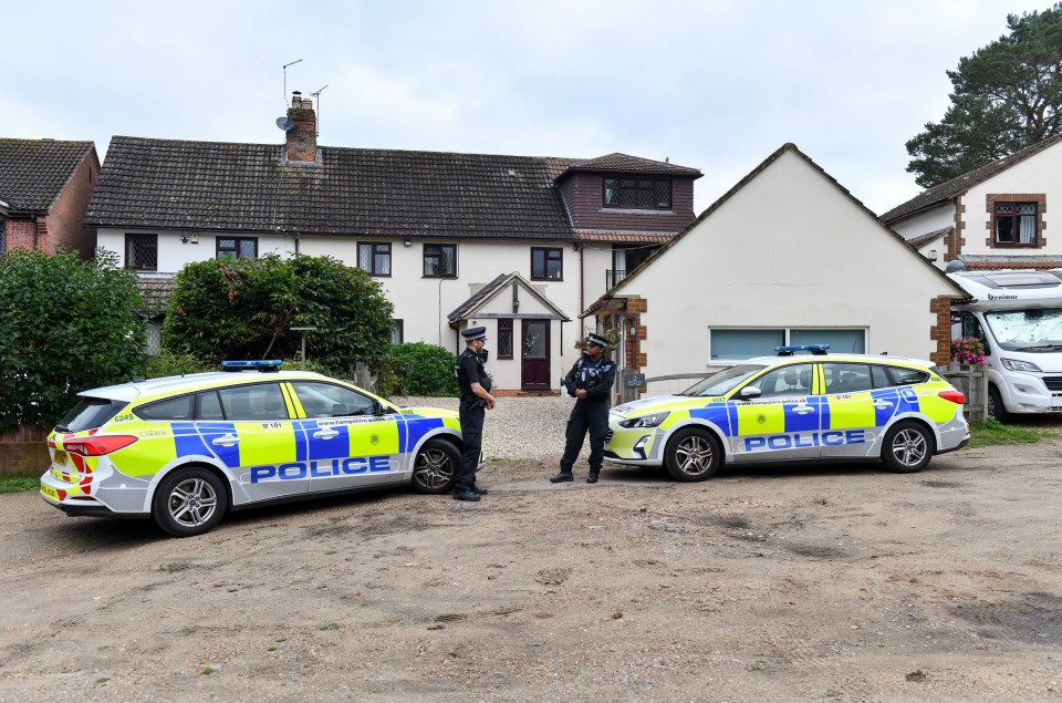 Cops standing guard outside the family home