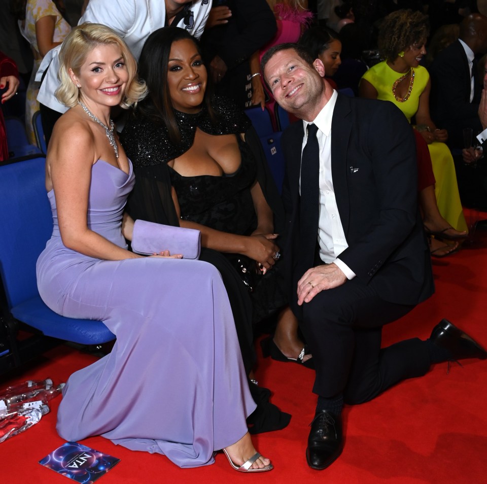 Holly was all smiles with Alison Hammond and Dermot O'Leary at the NTAs this week