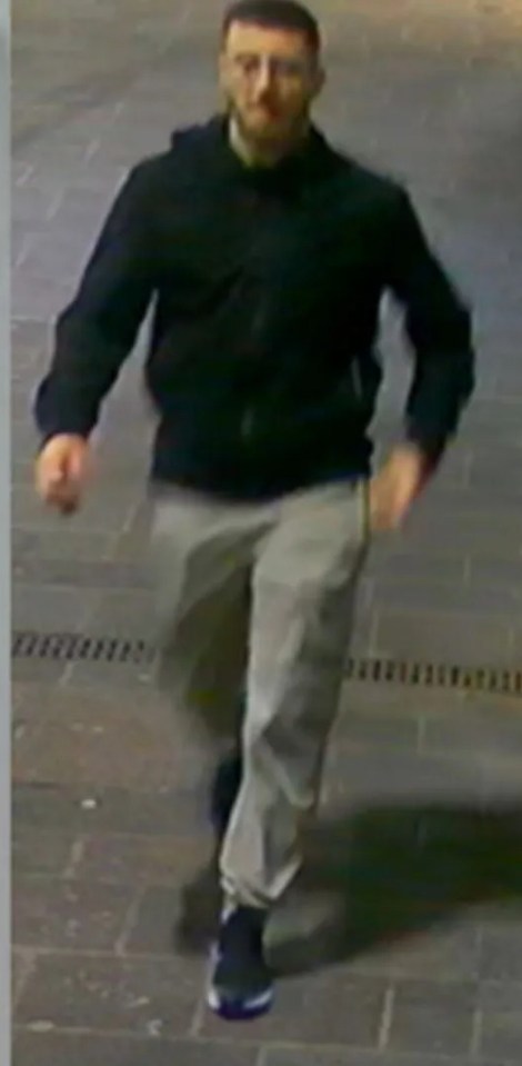 The man was pictured wearing a black jacket and glasses