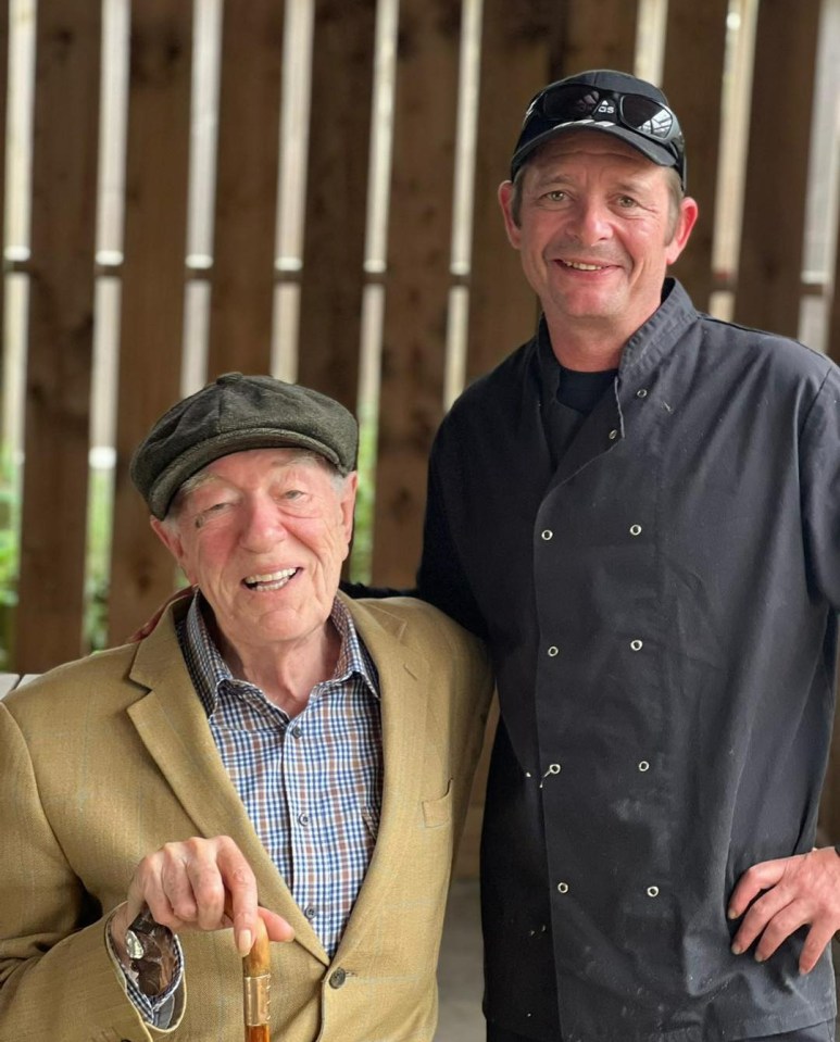 Sir Michael pictured with the head chef at The Fenn Bell Inn