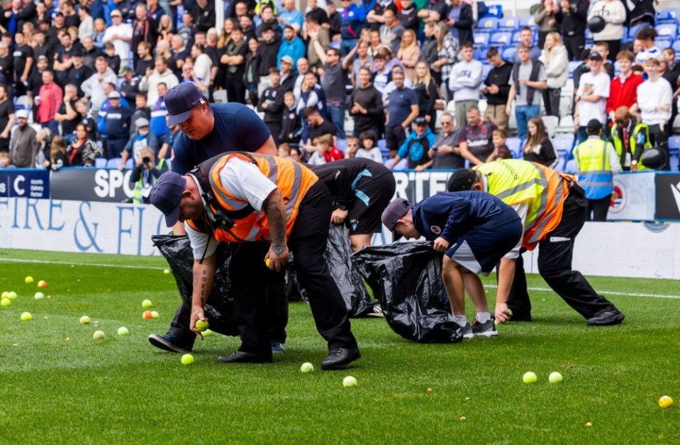 Reading fans threw tennis balls onto the pitch in protest