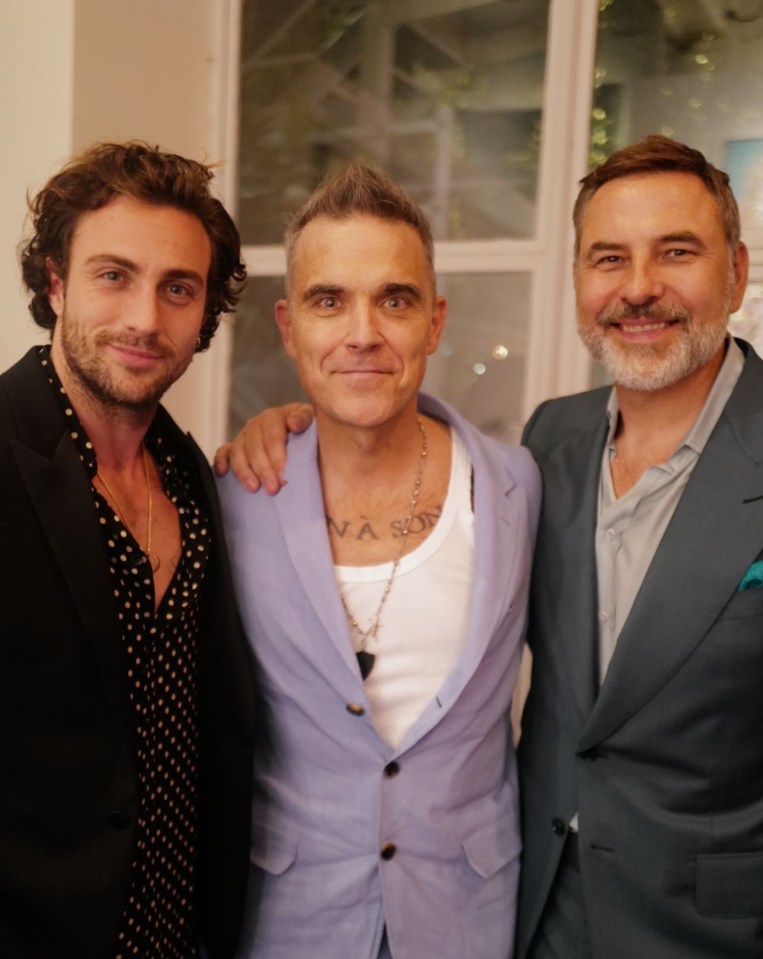 Telly star David also posed for photos with Robbie Williams and actor Aaron Taylor-Johnson