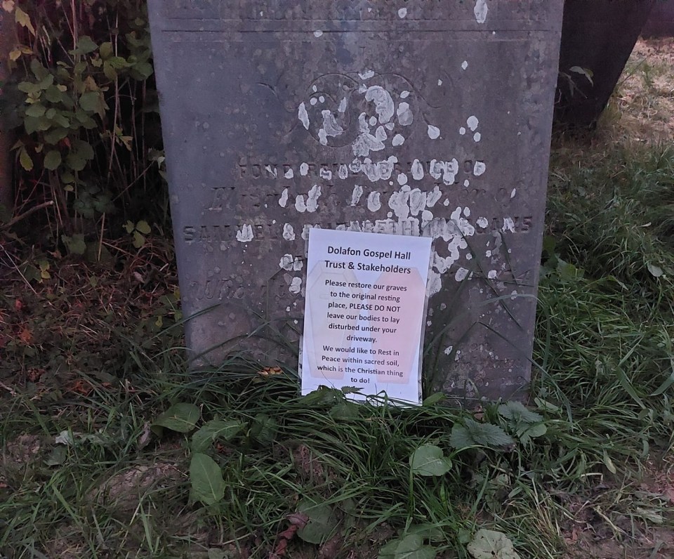 Letters complaining to the building's owners have been left on graves