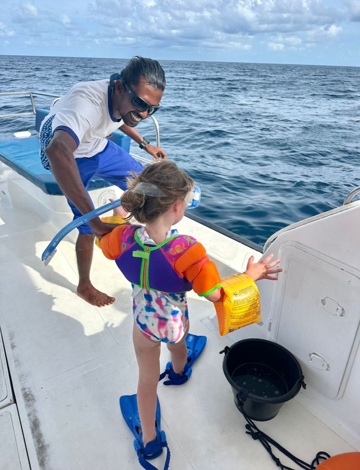 Tippi, 4, jumps into the sea for the Turtle Quest Experience