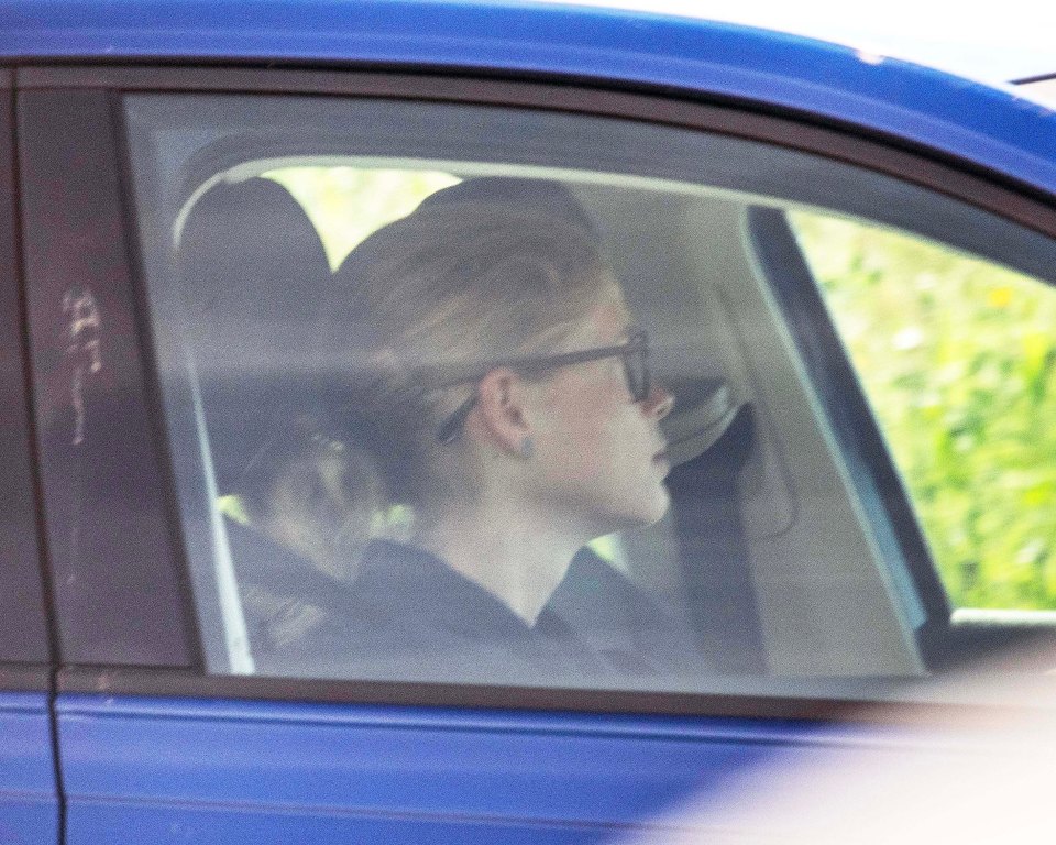 The royal wore her hair tied back as she took the car for a spin