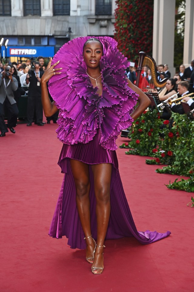 AJ Odudu dressed to frill in this purple piece of couture