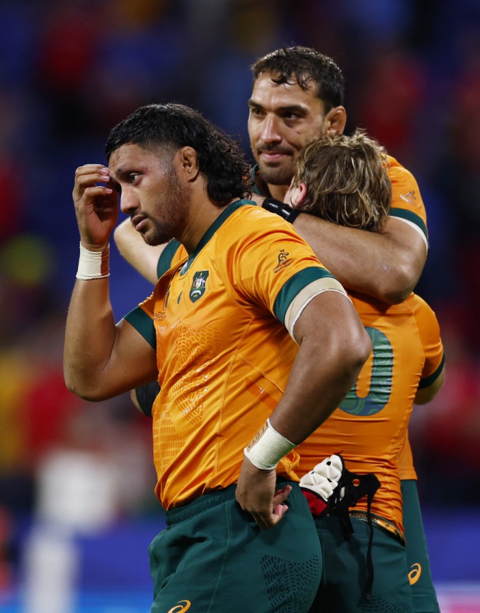 Australia's Fraser Mcreight, Richard Arnold and Robert Leota look dejected after the match