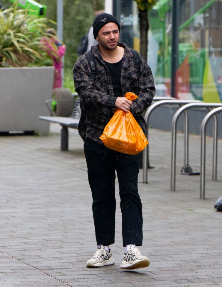 EXCLUSIVE: Strictly Come Dancing Contestant Adam Thomas Struggles With His Wrist Support As He And Luba Mushtuk Arrive For Rehearsals In Manchester. Adam Was Seen Visibly Struggling With A Wrist Support As He Hobbled Along The Pedestrian Zone Outside The Venue, Days After It Was Reported That Adam Is Struggling With Rheumatoid Arthritis. Adam and Luba are set to make their Strictly live show debut, alongside the other couples, on Saturday. Pictured: Adam Thomas Ref: SPL9926478 190923 EXCLUSIVE Picture by: SplashNews.com Splash News and Pictures USA: 310-525-5808 UK: 020 8126 1009 eamteam@shutterstock.com World Rights