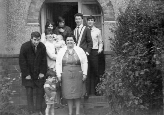 Carole pictured here, back left, and Elizabeth, centre left, with their family