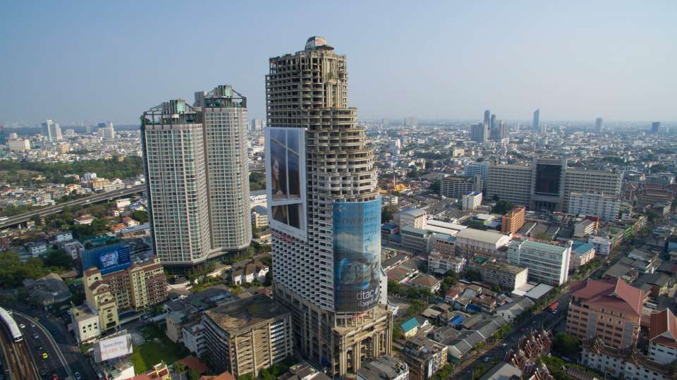 The derelict 'ghost tower' still dominates the Thai capital city skyline