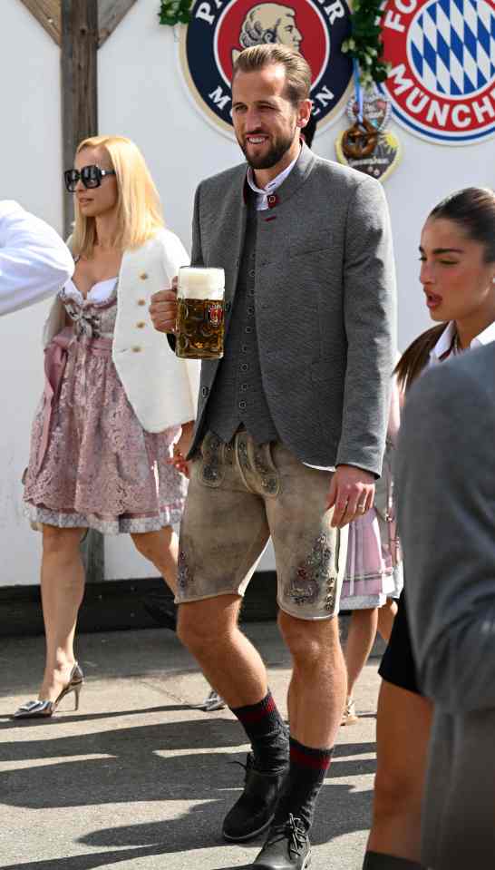 Harry Kane toasted his first Bundesliga hat trick for Bayern Munich in traditional German lederhosen at the Oktoberfest beer festival