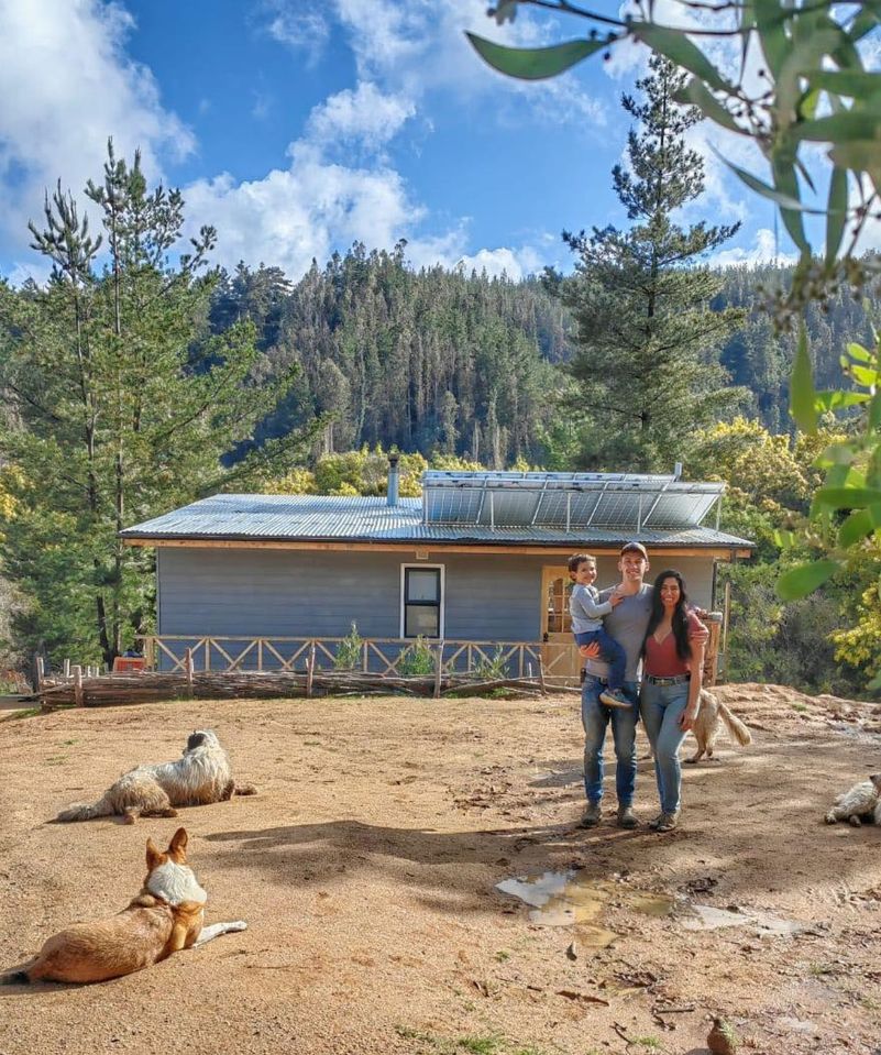 Scott and Scarlette Rawlings with son Lucas at their remote Chilean wilderness cabin