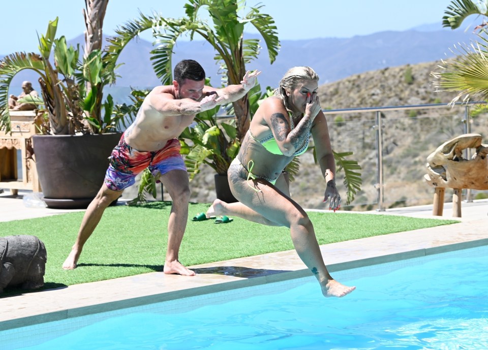 Kerry Katona and Ryan Mahoney play together by the pool of their luxury villa