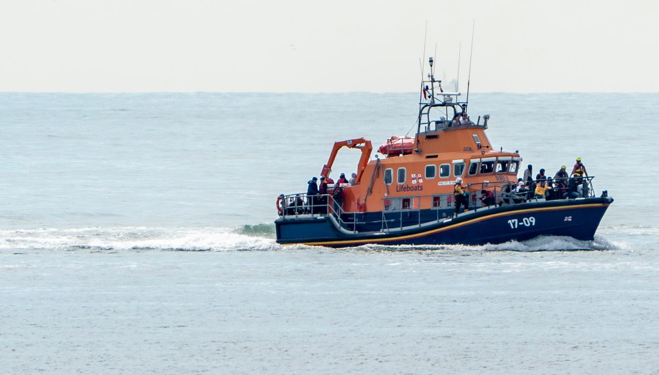 Chris Eades - 07980 775577 - 2/9/2022.A life boat boat arrives at Dover harbour loaded with migrants who have attempted to cross the Channel today.