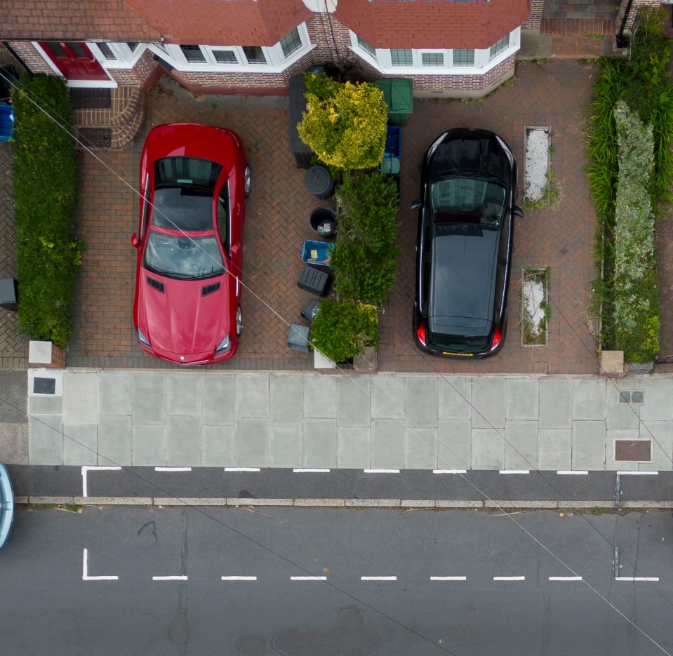 A row among neighbours is accelerating after new parking bays were painted across some driveways