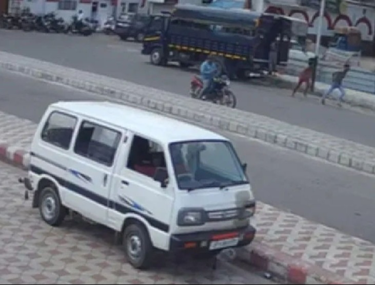 The inmates were seen fleeing the blue police van parked across the street