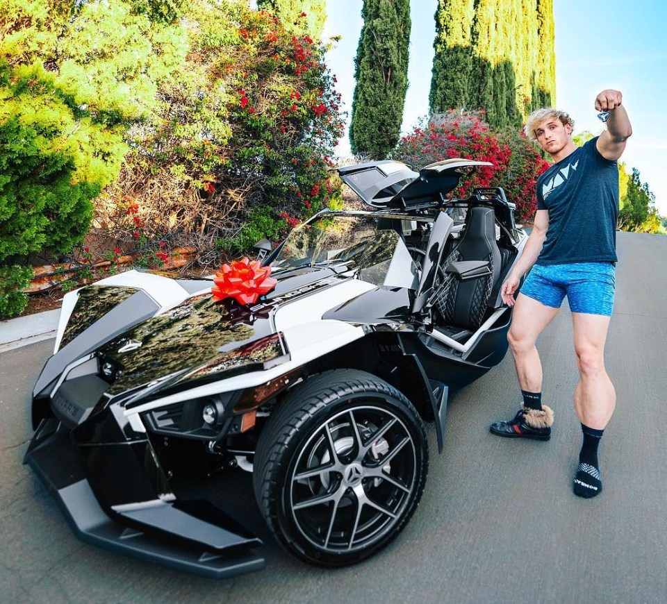 Logan Paul poses with his trendy Polaris Slingshot