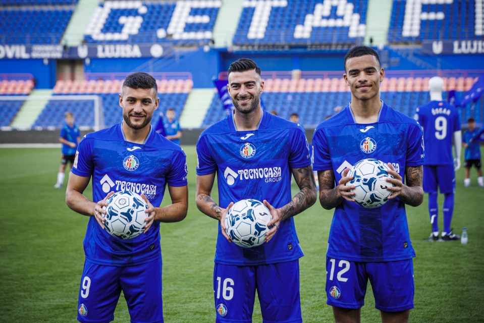 Mason Greenwood (right) being presented alongside Diego Rico and Oscar Rodriguez