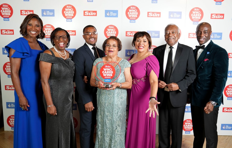 Victoria Bateman, Michelle Bateman, Liam Dinnall-Bateman, and Paulette Simpson CBE, were presented with the award by Tim Campbell MBE and Denise Lewis