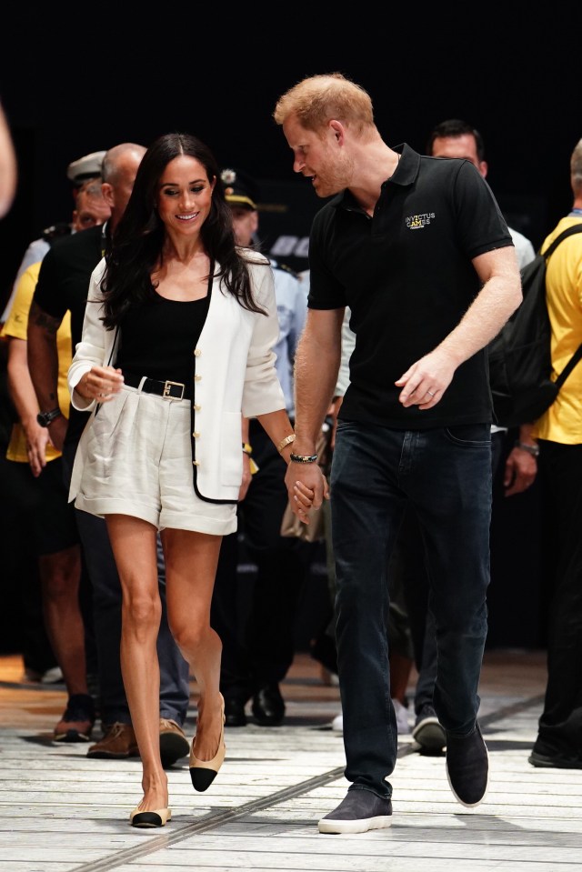 Today the couple held hands are they arrived at a sports arena in Dusseldorf for Harry's Invictus Game