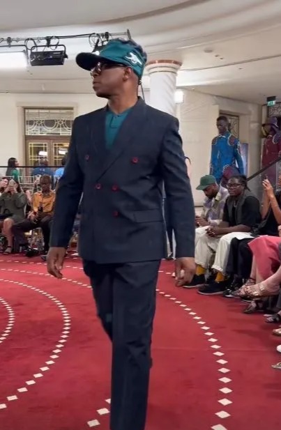 Ian Wright made his catwalk debut for a suit brand