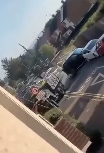 The truck hit a parked car and a road sign as the driver tried to escape