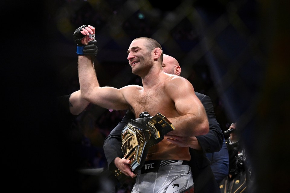 Strickland celebrates with the middleweight belt