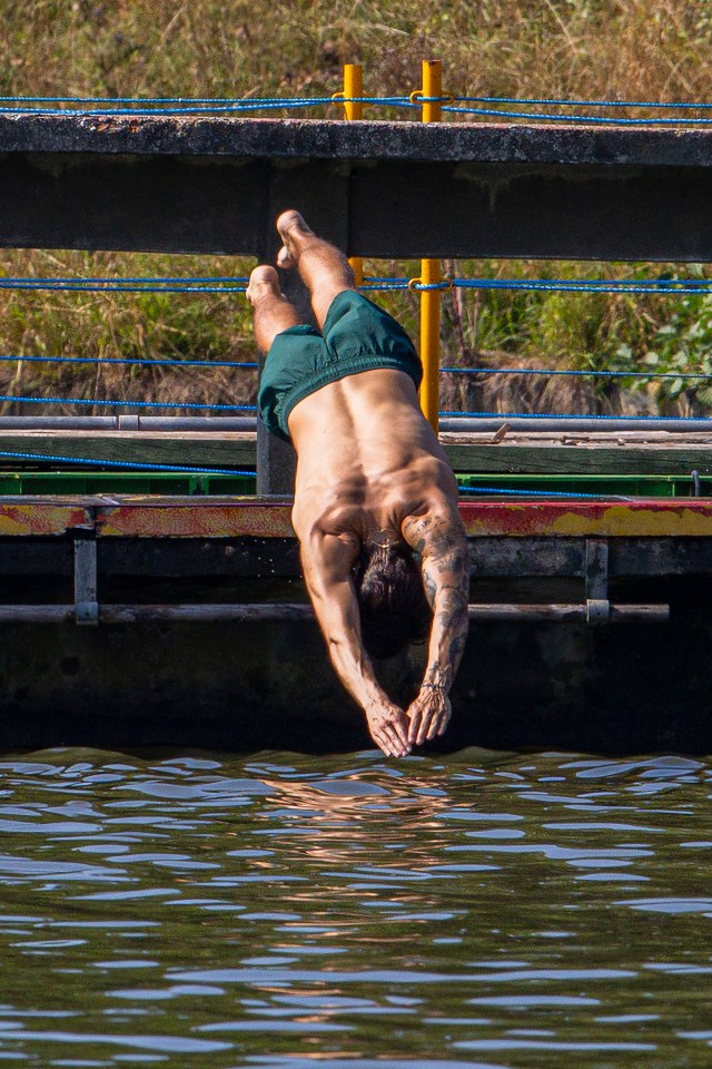 Styles showed off his gym-honed physique as he dived into the Hampstead public ponds