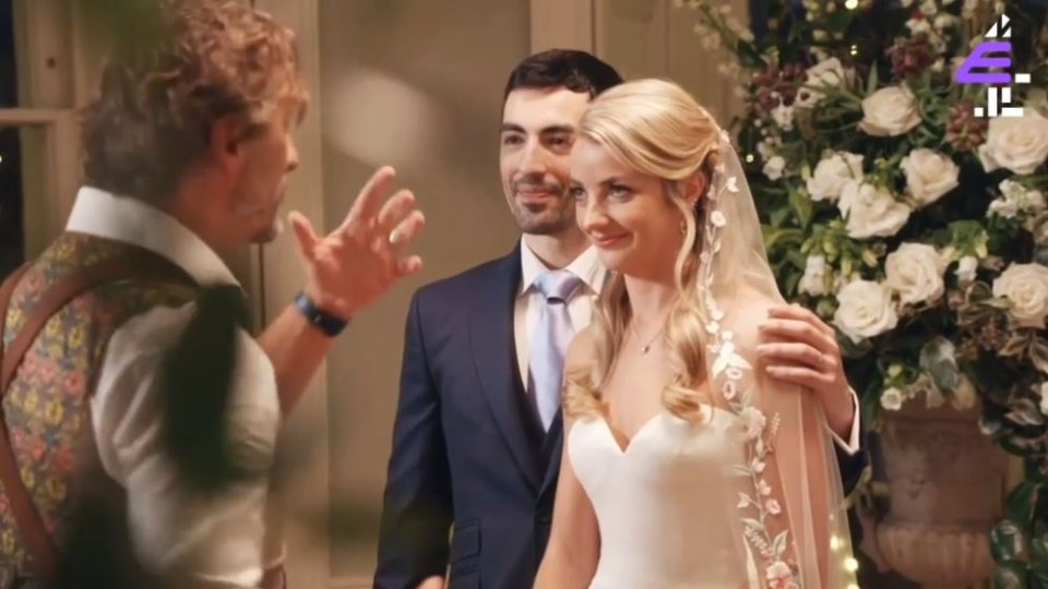 The pair were encouraged by their photographer to kiss despite the frosty reception