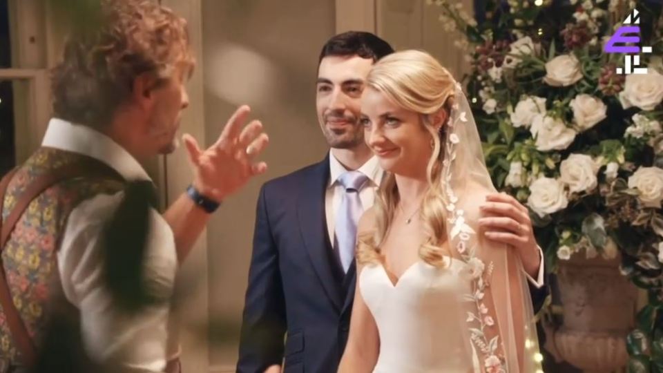 The pair were encouraged by their photographer to kiss despite the frosty reception