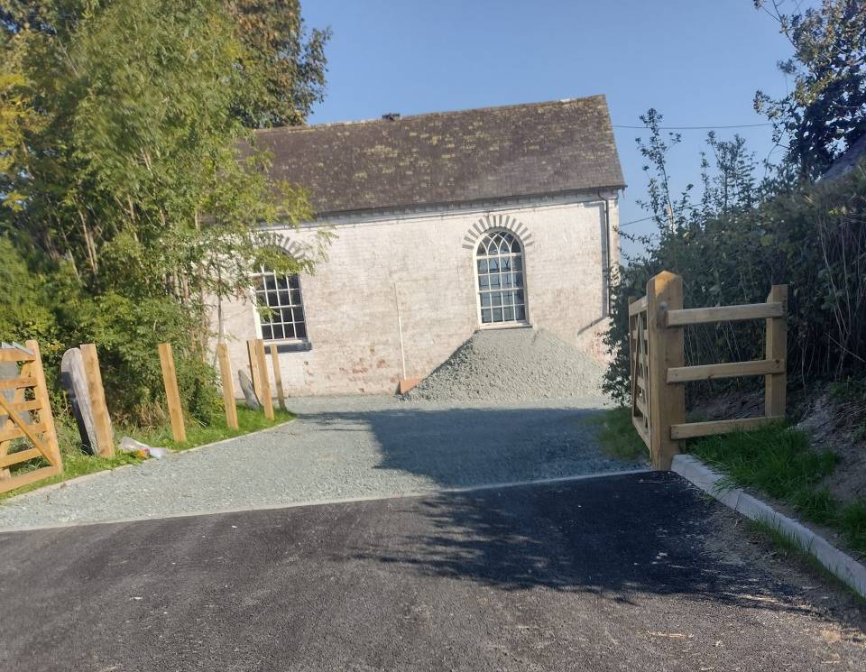 Planning permission was granted for a new driveway approaching the church