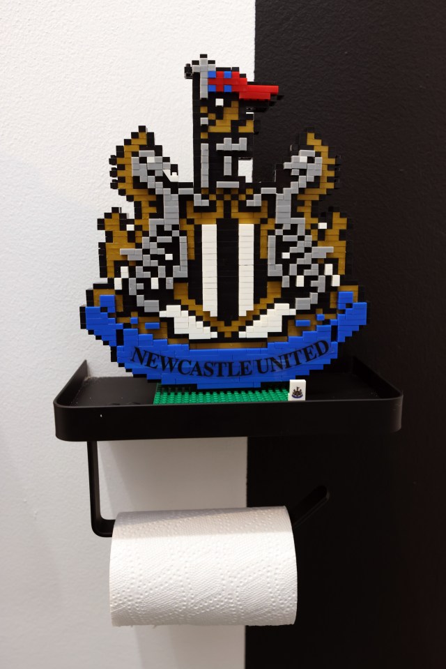 The dad of three has kitted the room out with a Lego copy of the Newcastle United badge above his toilet roll