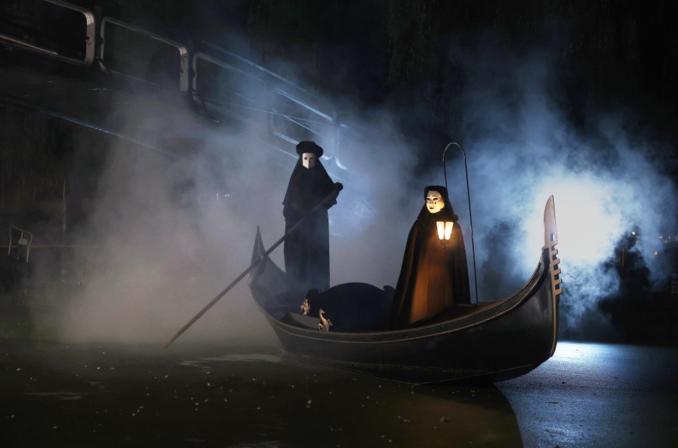 Two spooky figures on a traditional Venetian Gondola on the Regents Canal