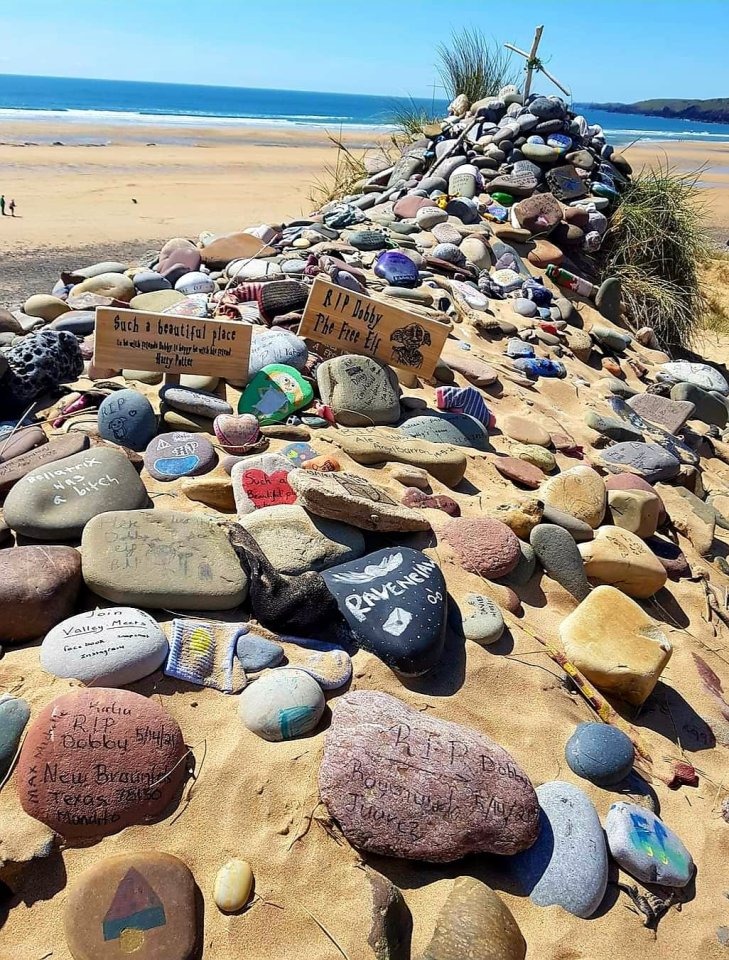 A vast shrine on a Freshwater West beach where Dobby was 'buried' includes hundreds of painted stones and other tributes