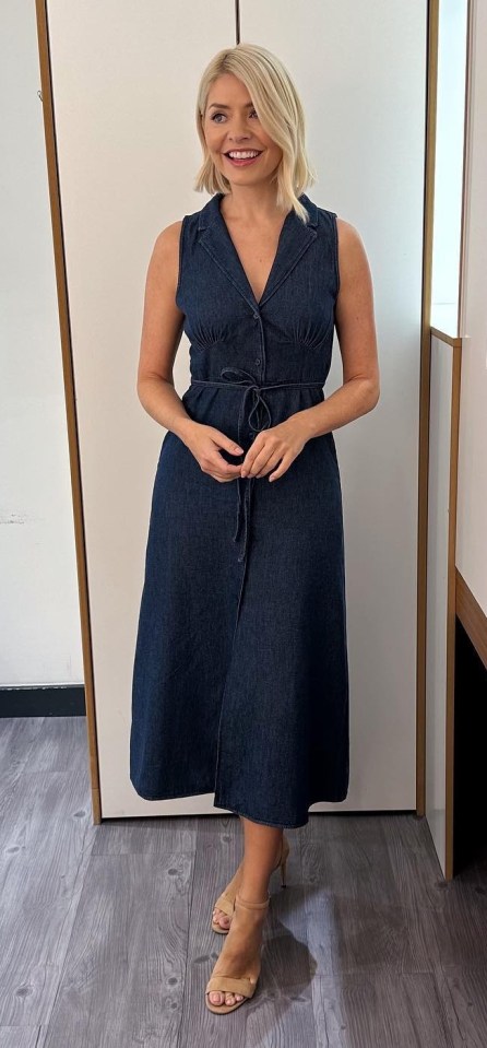 Holly has continued to dazzle on-screen despite the social drama and today sported a plunging denim dress