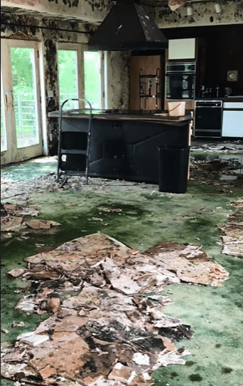 The old fire station was covered in black mould and falling down