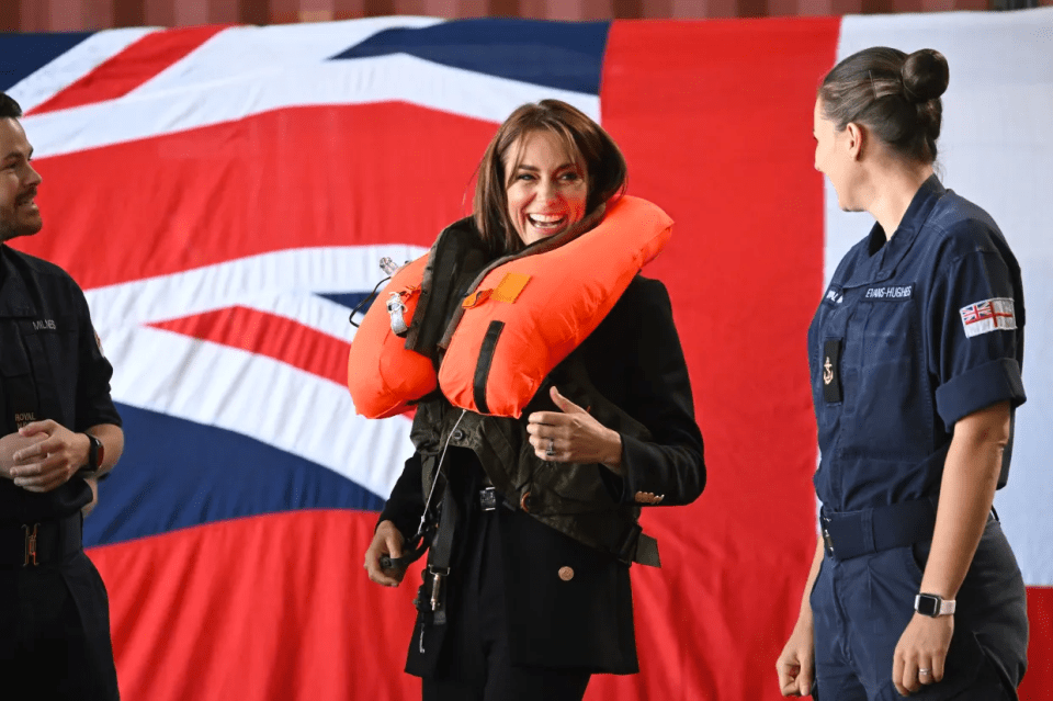 She was all smiles after successfully inflating her life vest