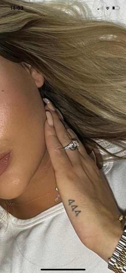 The blonde beauty had an engagement ring tattoo on her ring finger