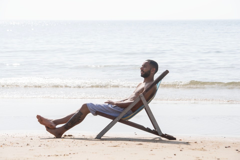 John Kennedy Junior, 25, makes the most of warm weather at Bournemouth beach