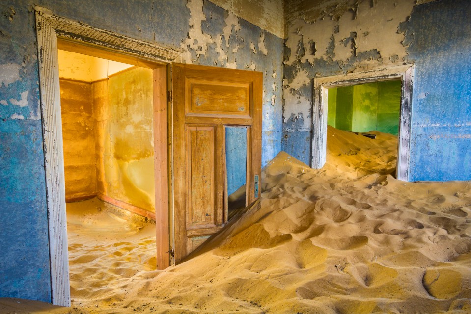 Sand dunes broke through the doors, damaging them and piling up inside the houses