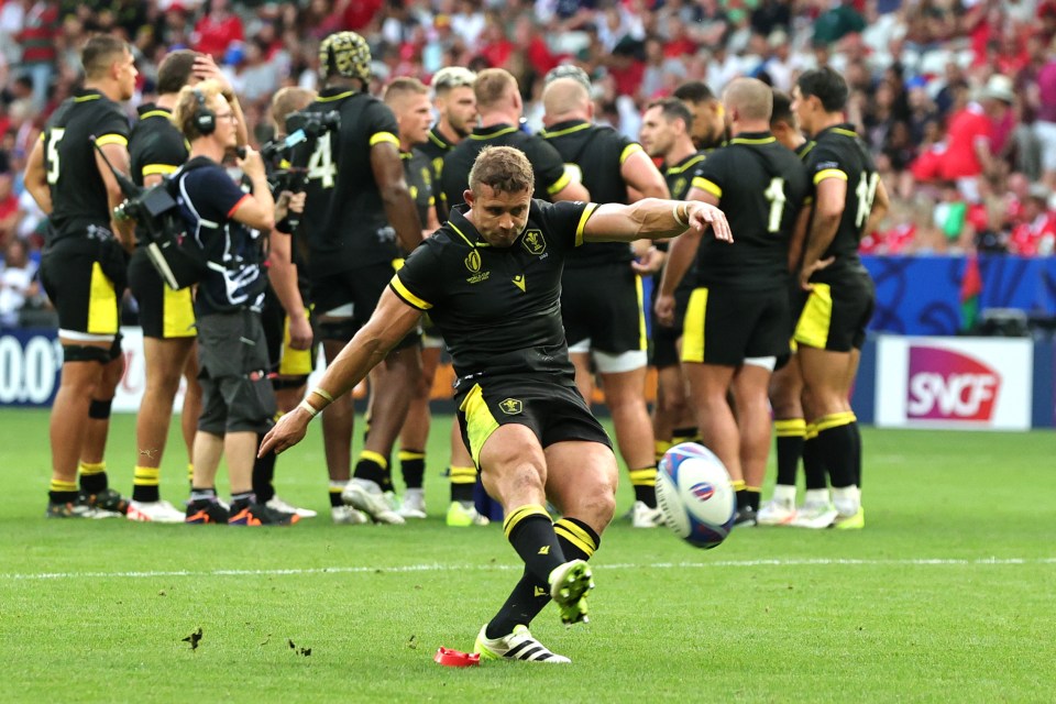 Leigh Halfpenny of Wales kicks a conversion