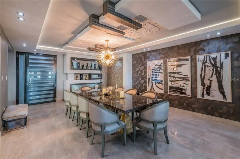 Marble flooring decorates plush dining room