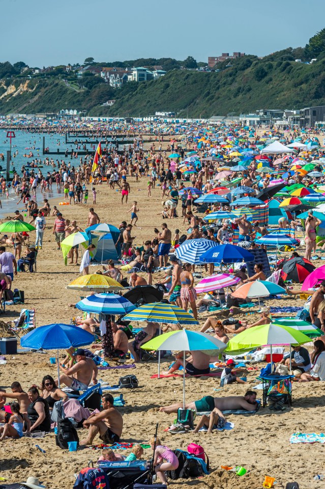 People pack on to the beach during a busy Saturday in Bournemouth, Dorset