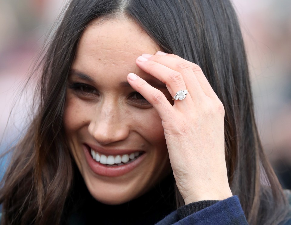 The stunning engagement ring features two of Princess Diana’s diamonds