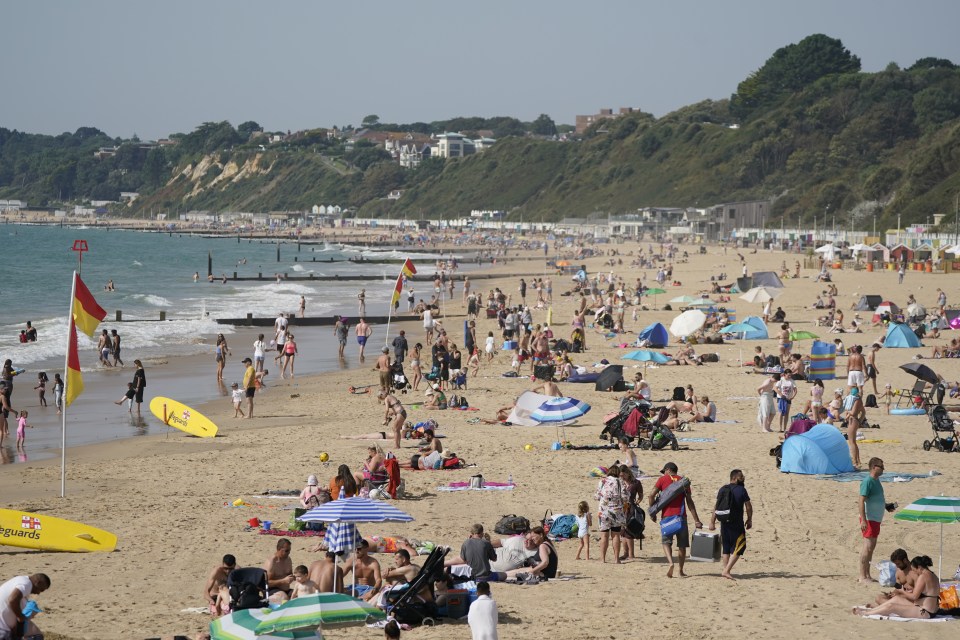 People enjoying the warm weather on Bournemouth beach in Dorset today