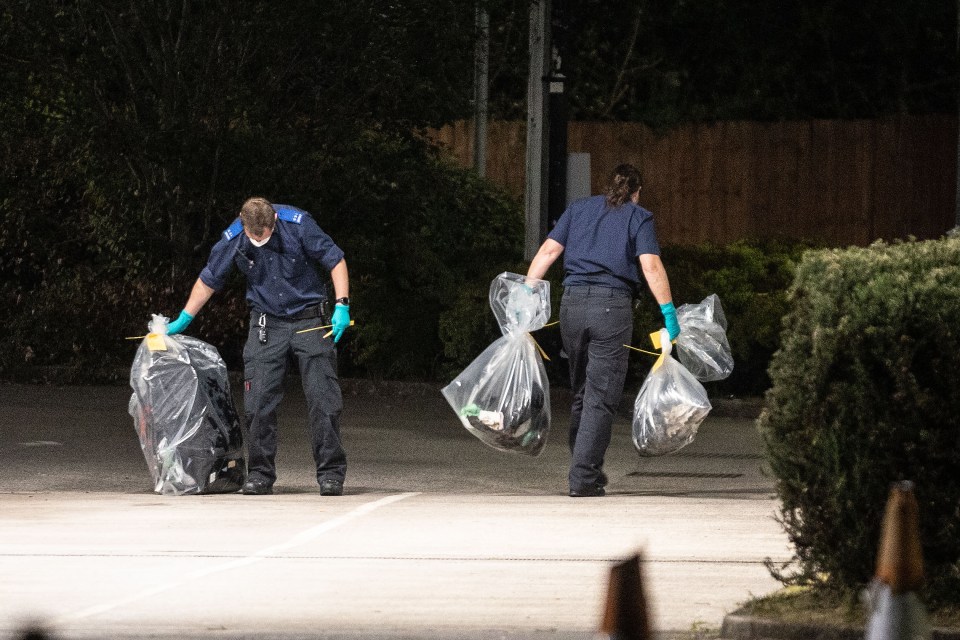 Cops collecting evidence at the petrol station after the horror