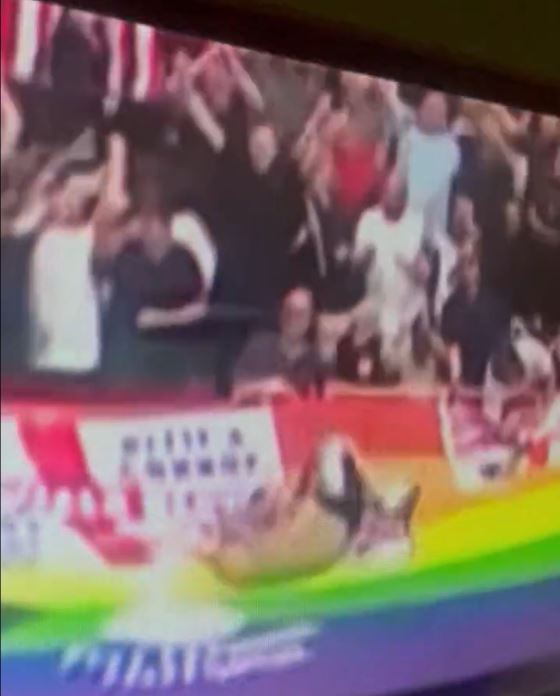 The supporter went tumbling over the LGBTQ+ flag