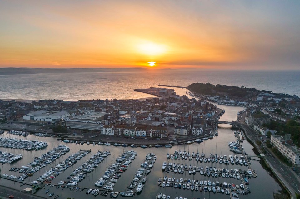 A beautiful sunrise in Weymouth in Dorset due to Sahara dust in the air this morning